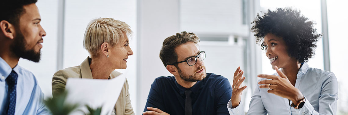 People at a table planning a meeting